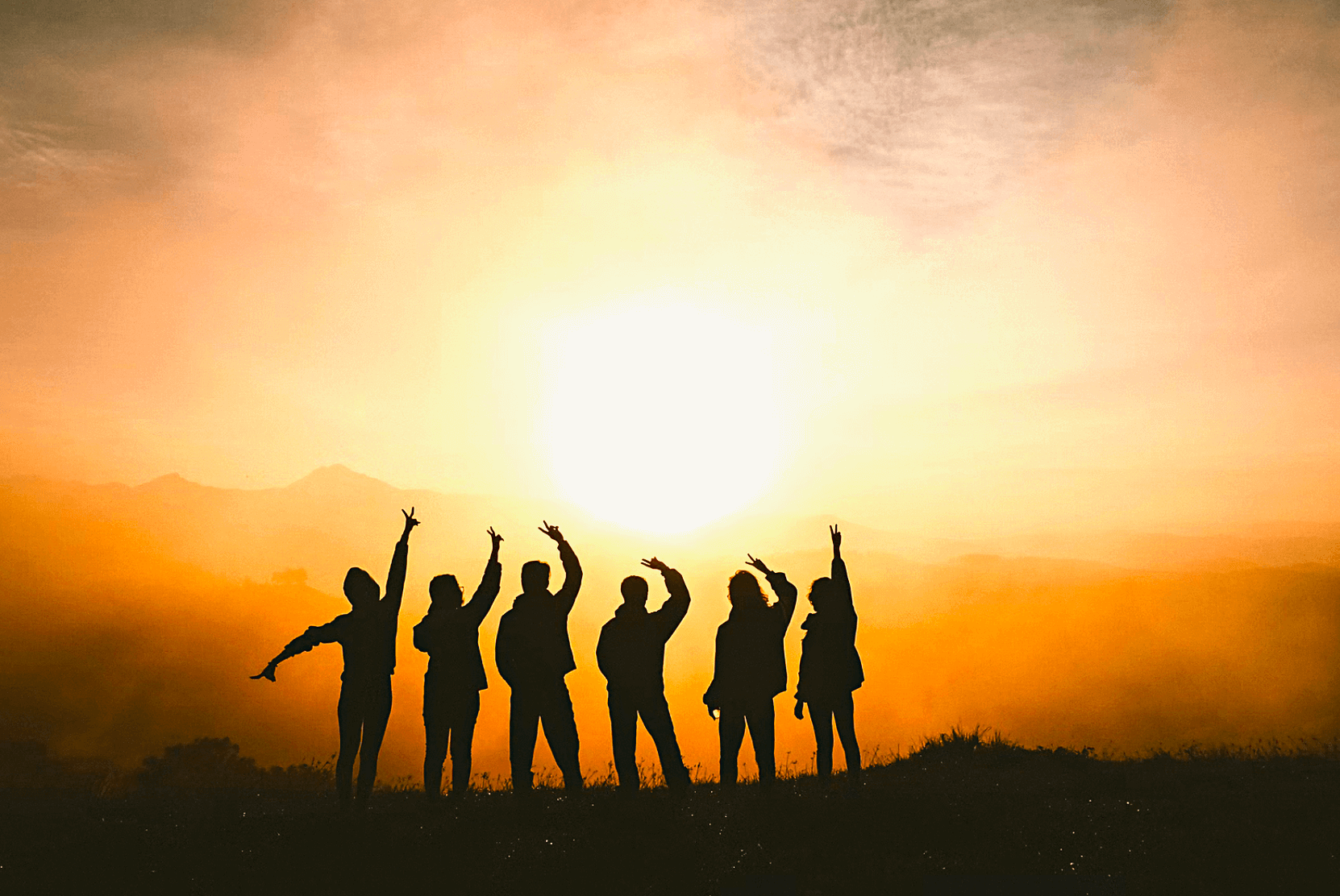 people silhouettes in a sunset